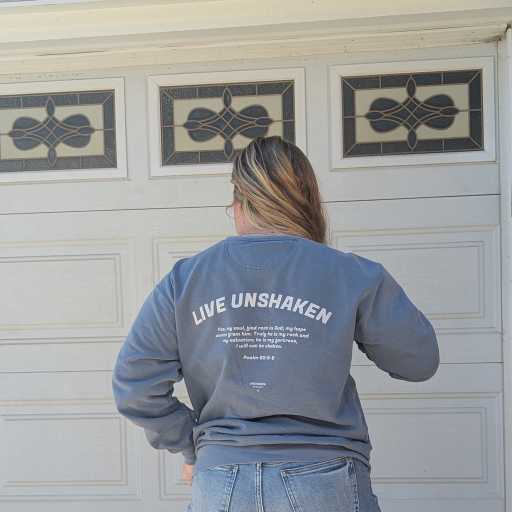 Live unshaken sweatshirt with Psalm 62:5-6 printed on the back and Unshaken Strength logo below
