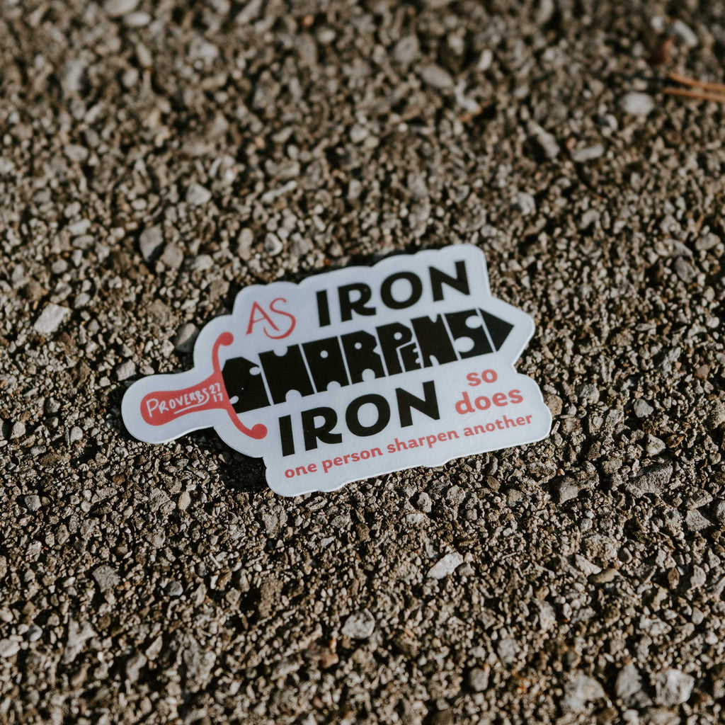 Sticker with motivational quote on a textured surface