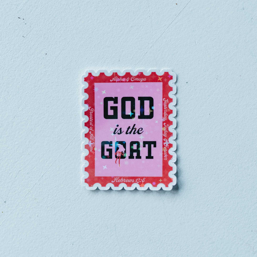 Sticker with 'GOD is the GOAT' text on a light blue background